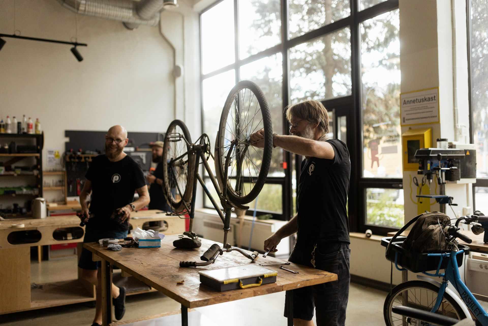 259195 Man Repairing Bicycle in Workshop Web Version 1920px