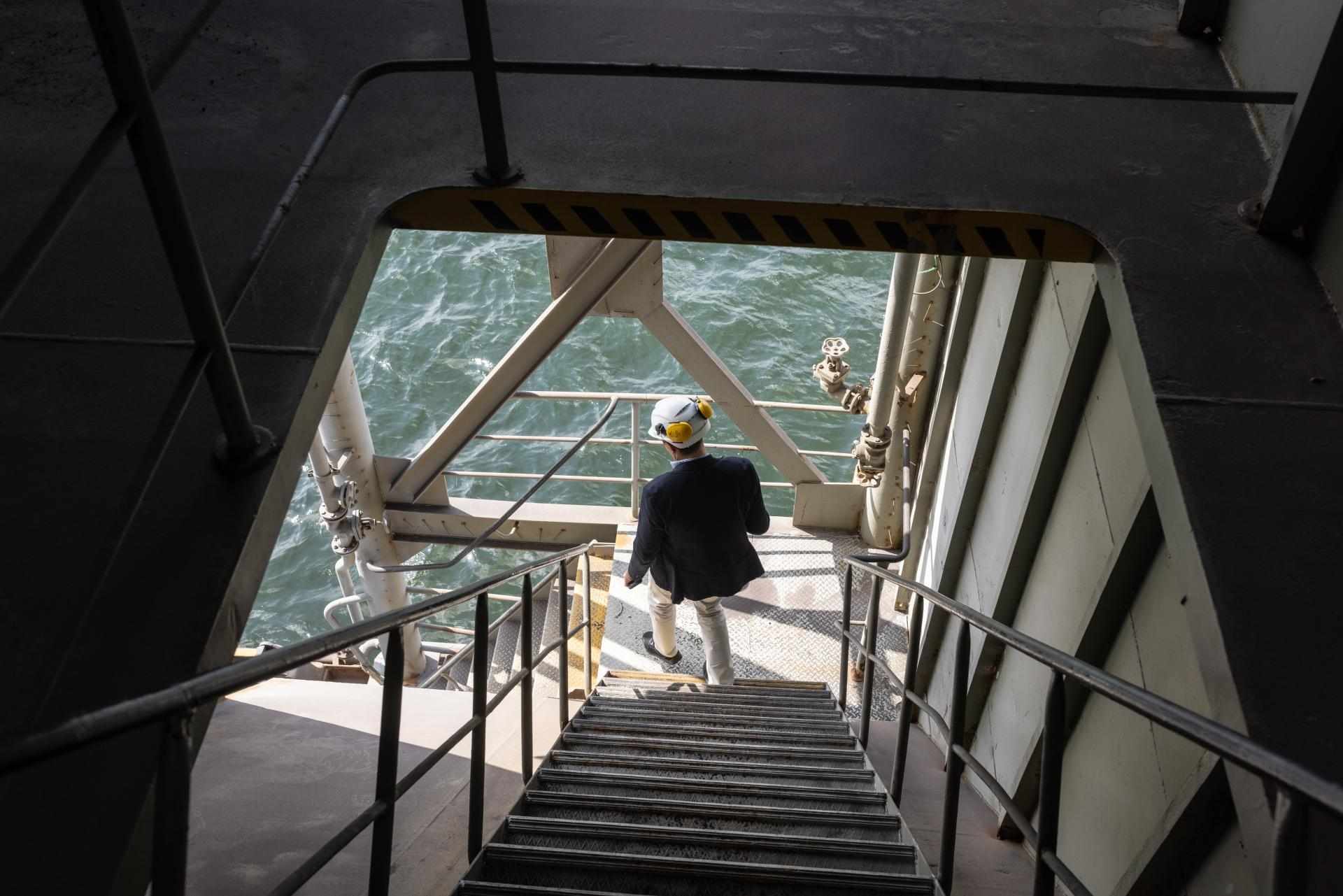 Man Inspecting Ship Components