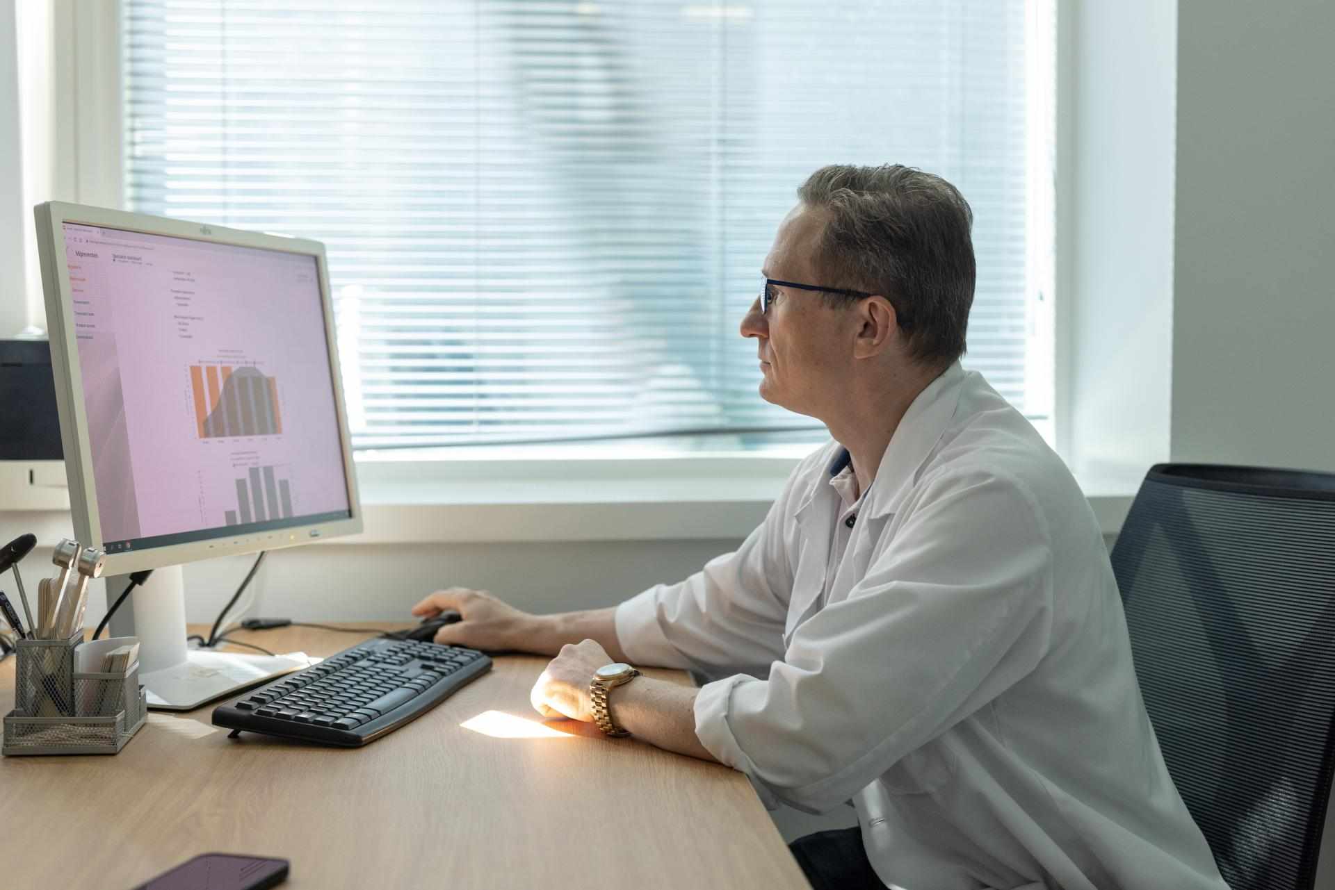 Doctor Analyzing Patient Data
