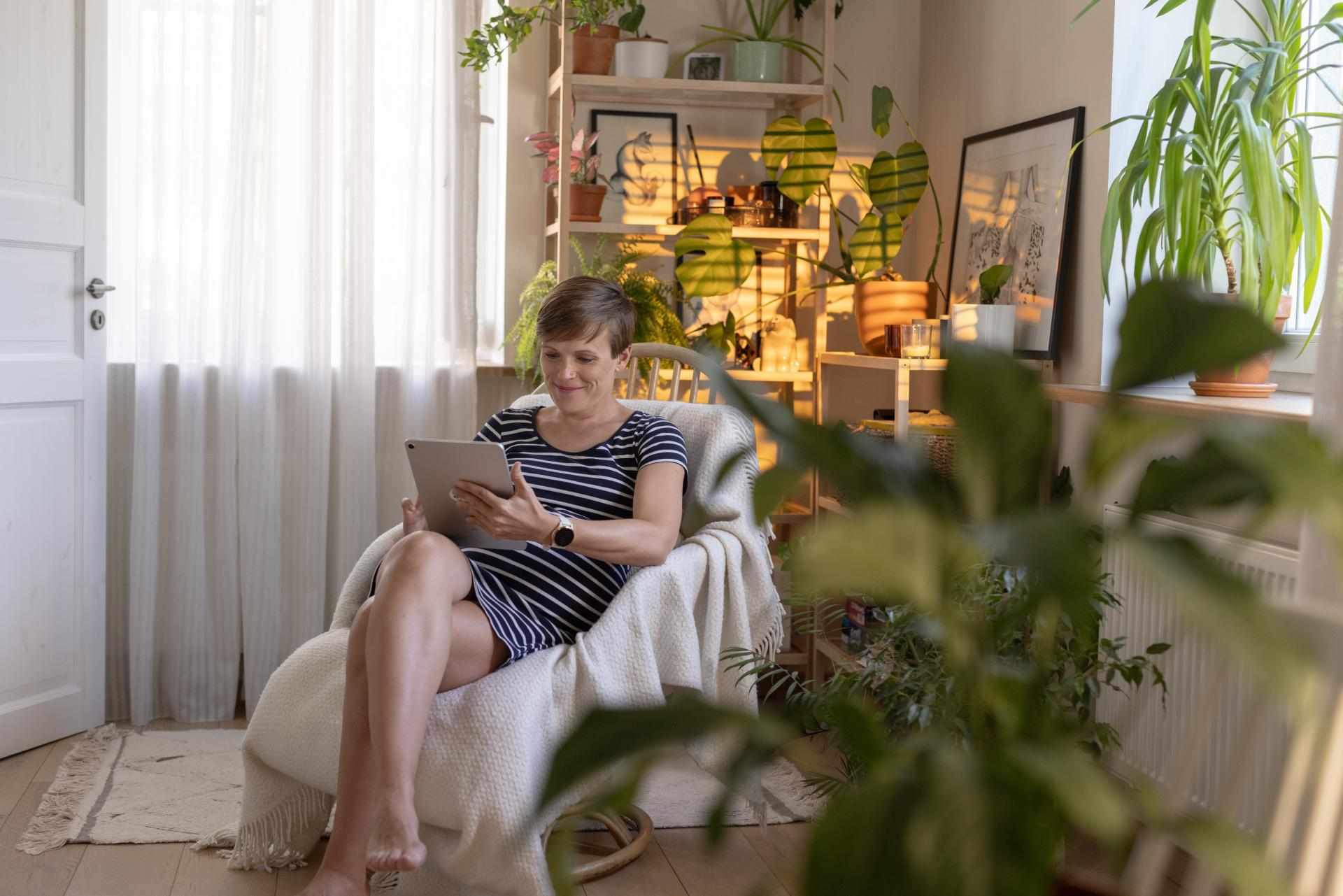 Woman Tracking Health on Tablet