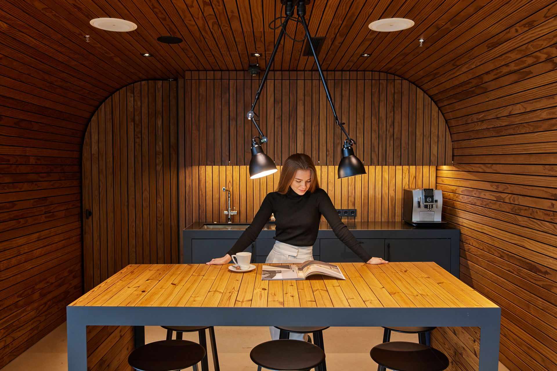 657514 Woman Reading in Modern Wooden Kitchen Web Version 1920px