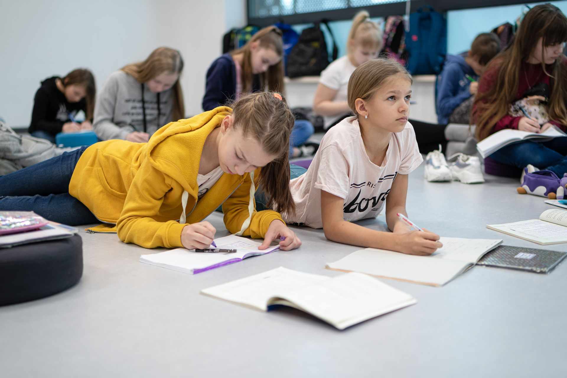 252755 Children Writing Tasks in Classroom Web Version 1920px